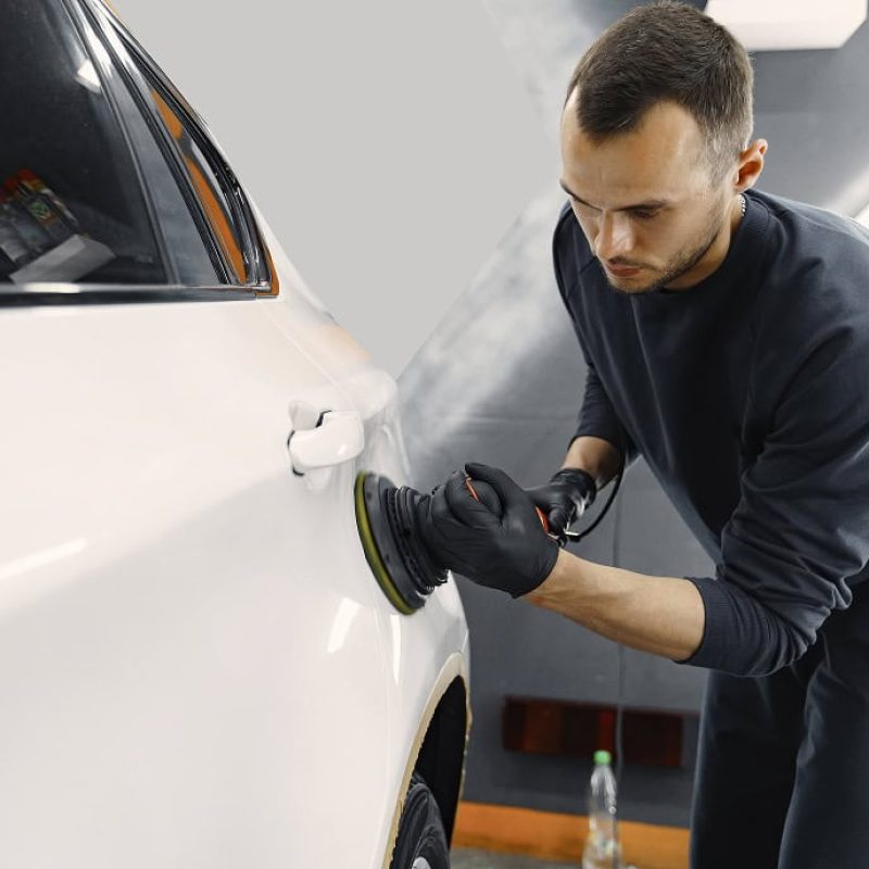 man-polish-car-garage 1